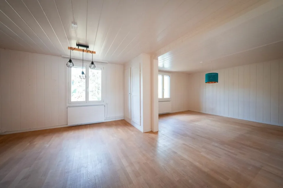 Two-family house with garages, workshop, and storage rooms for sale