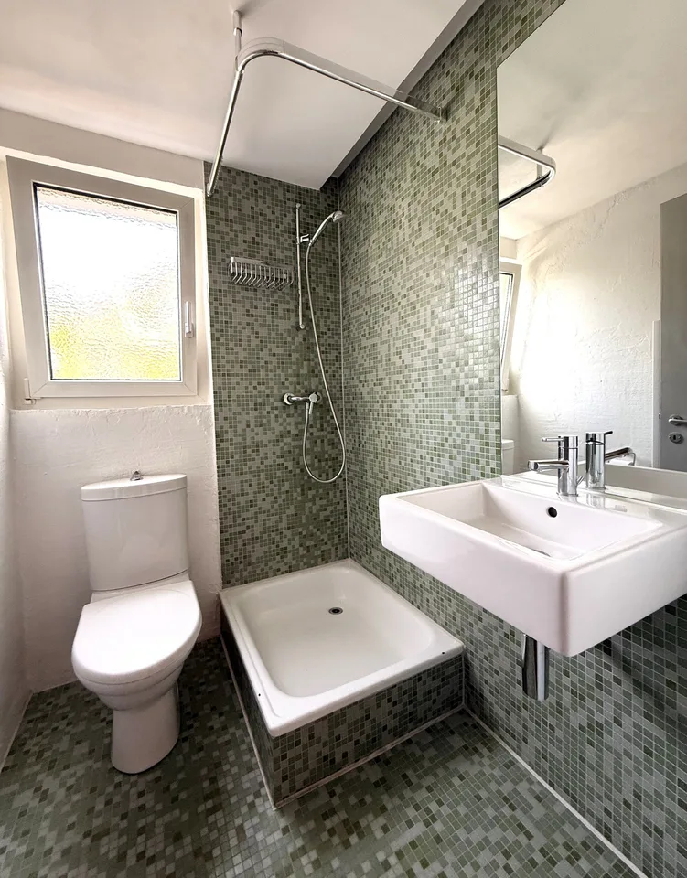 Stylishly modernized semi-detached house with high-quality construction, garden, and plenty of living quality