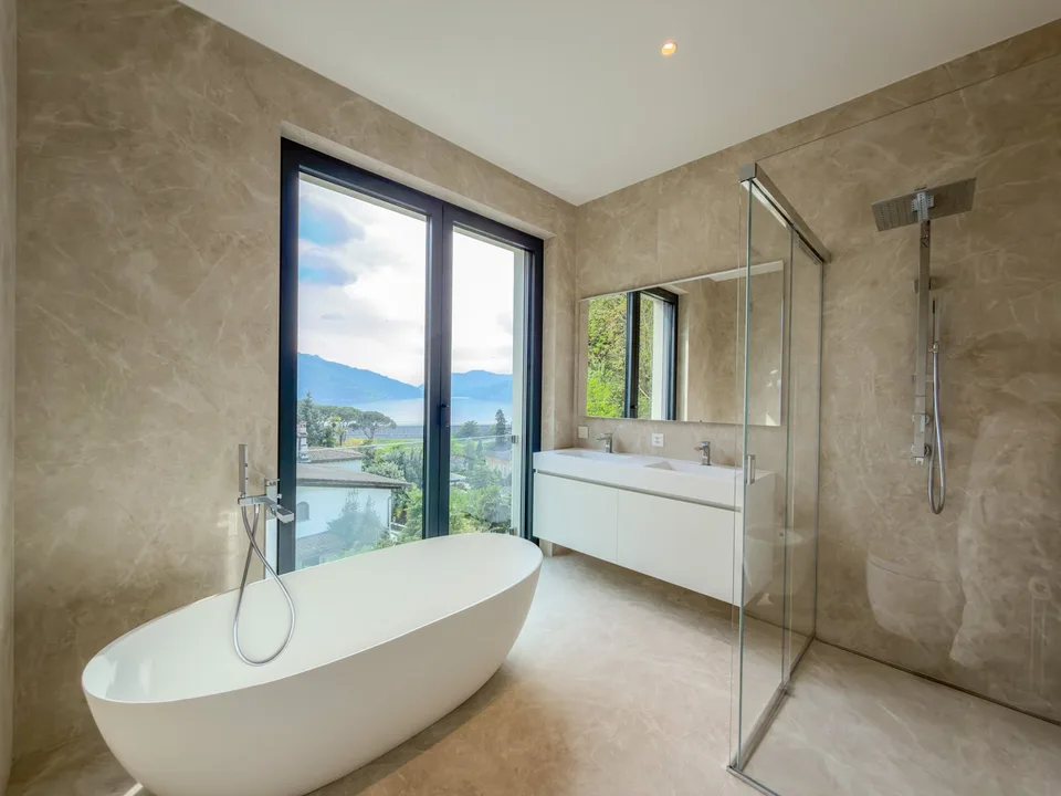 Spacious attic with magnificent lake-view terrace in Bissone