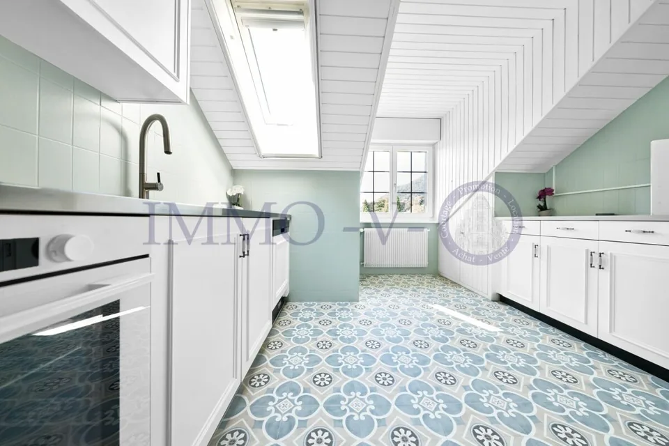 SPACIOUS RENOVATED ATTIC WITH CHARACTER WITH BALCONY-TERRACE AND LAKE VIEW