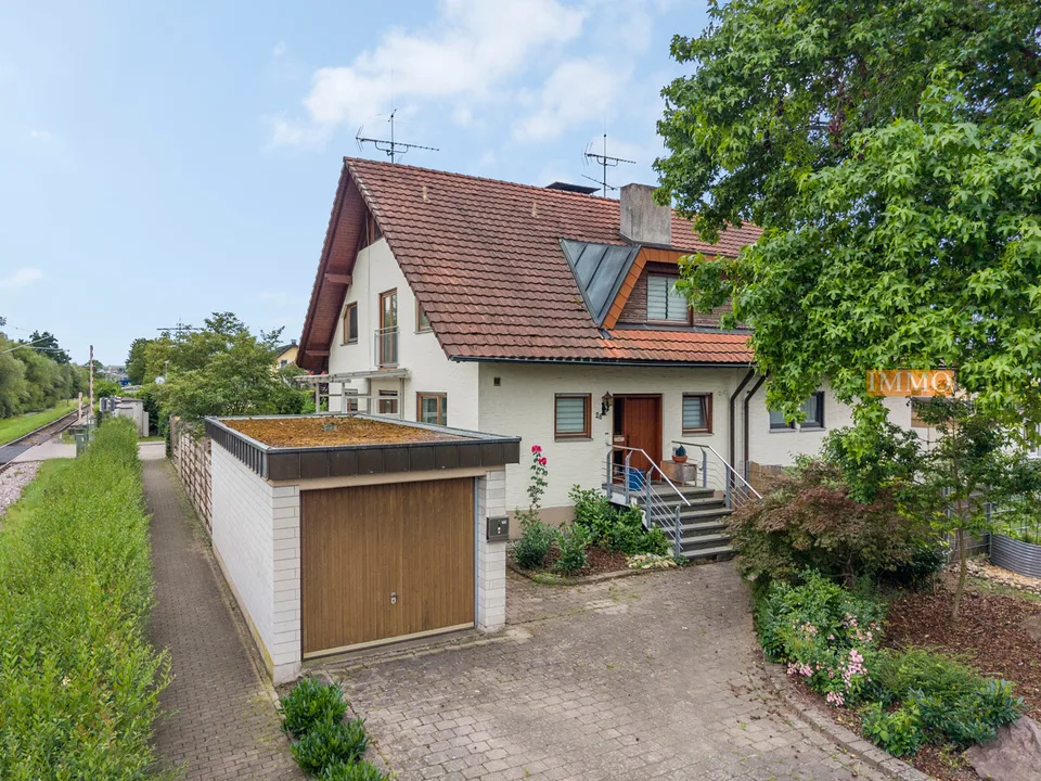 IMMORath.de - Doppelhaushälfte mit Einliegerwohnung und Garage