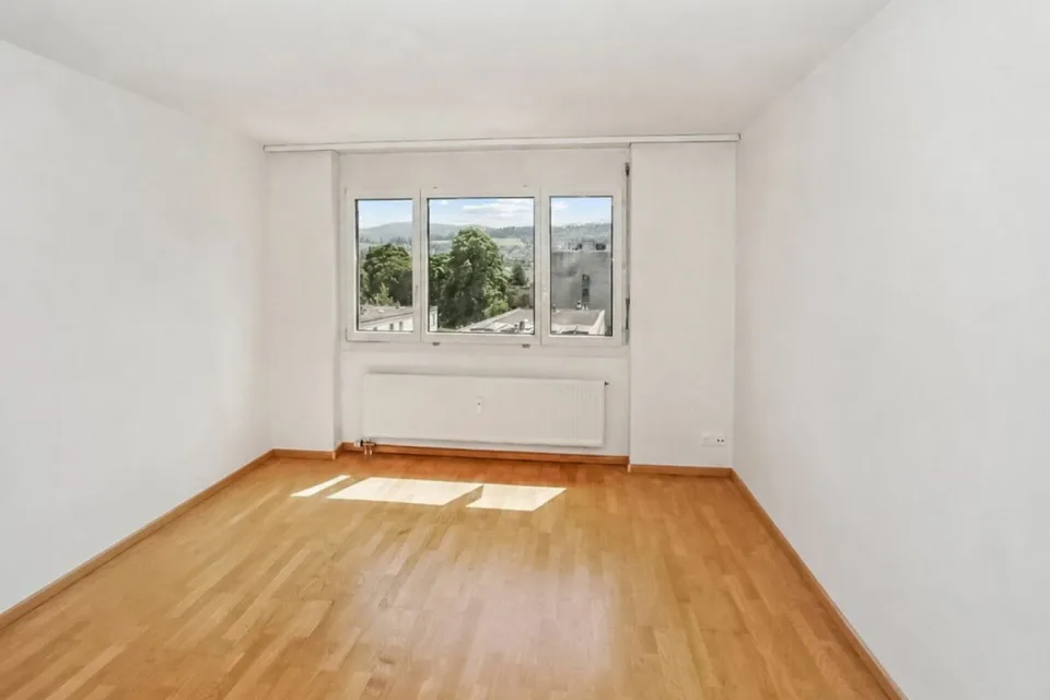 Sunny 2.5-room apartment with beautiful views and parking space in Aesch