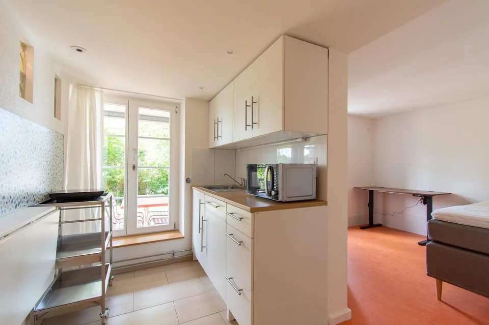 Möblierte 1.5 Zimmer-Wohnung mit Terrasse an bevorzugter Lage