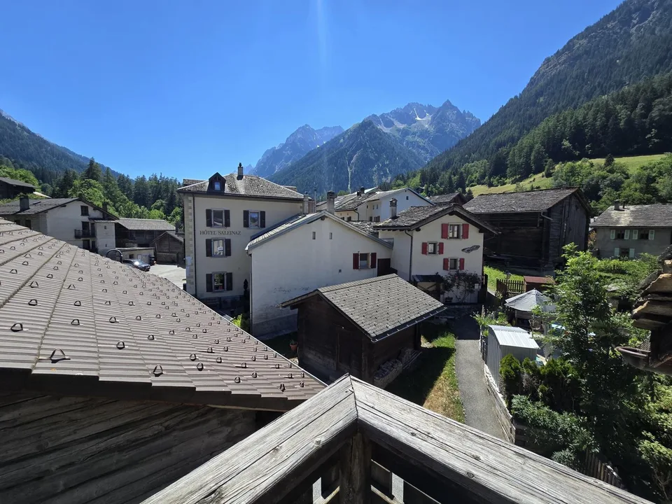 A Place of Life and Opportunities in the Heart of Val Ferret: Mixed-Use Building, Café-Restaurant and 3 Apartments, Barn and Garden