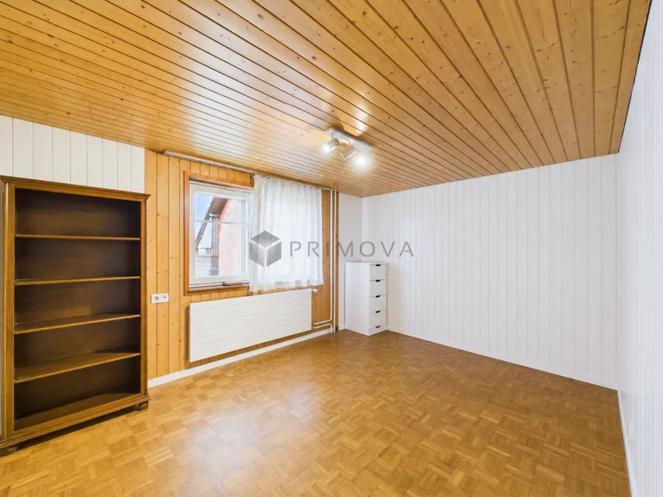 Modernized two-family house with a far-reaching view, double garage, and plenty of space