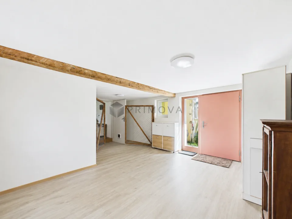 Modernized two-family house with a far-reaching view, double garage, and plenty of space