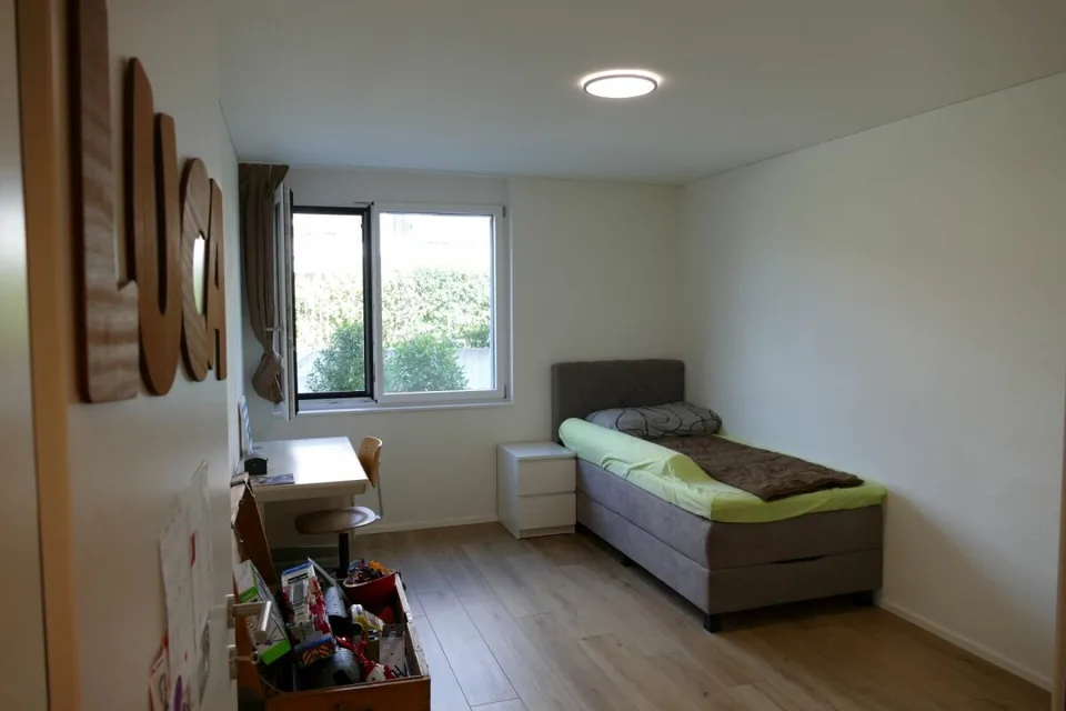 Appartamento di 4,5 locali al piano terra con area di giardino