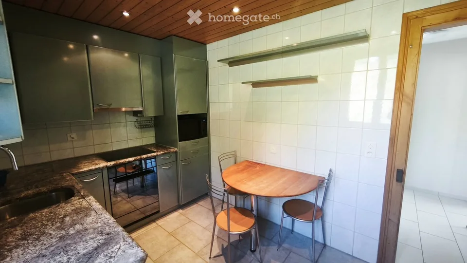 Appartamento di 5,5 locali con balcone e area giardino