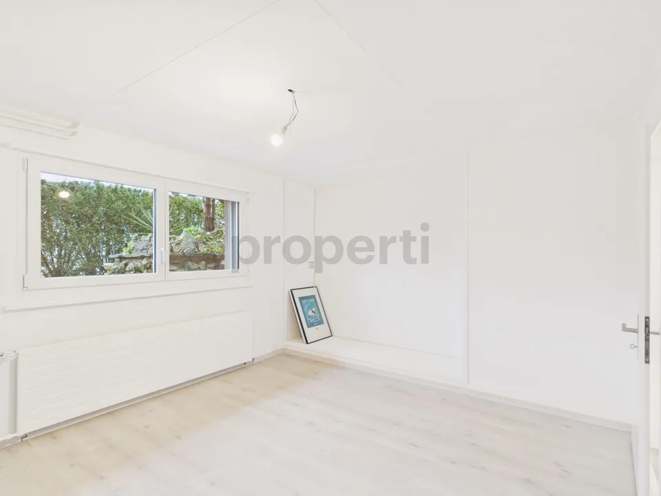 Modern 6.5-room renovated row house with garden in La Neuveville