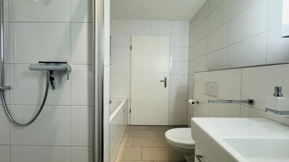 4.5-room maisonette with balcony, 2 wet cells, 2 underground parking spaces, laundry tower, and basement