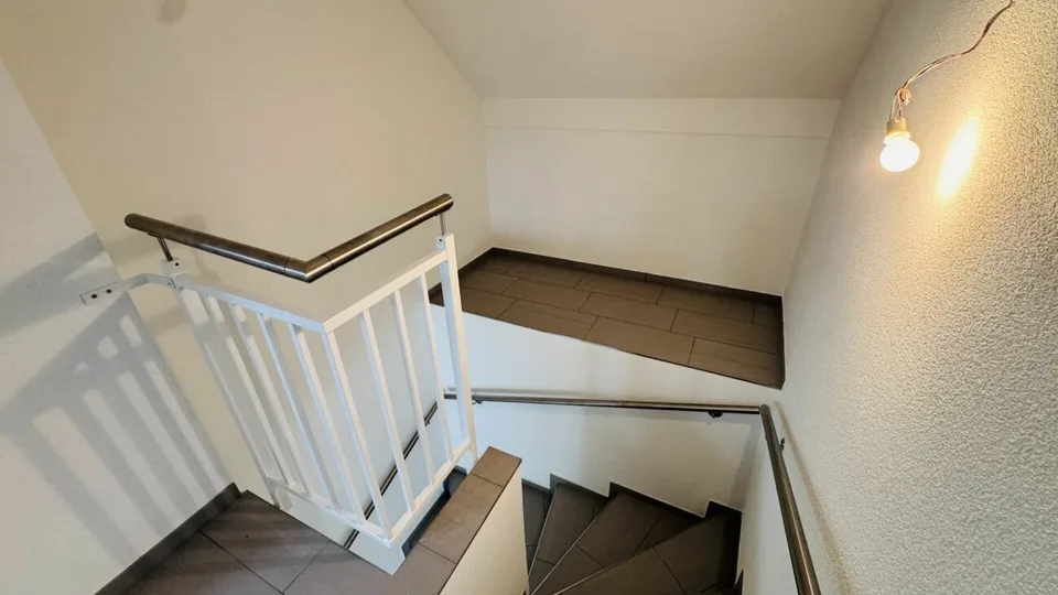 4.5-room maisonette with balcony, 2 wet cells, 2 underground parking spaces, laundry tower, and basement