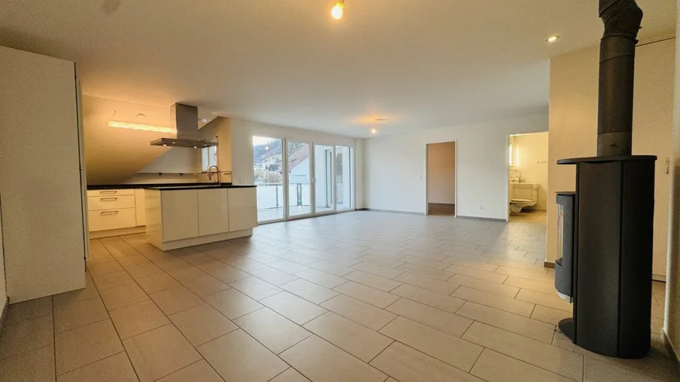 4.5-room maisonette with balcony, 2 wet cells, 2 underground parking spaces, laundry tower, and basement