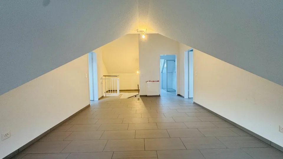 4.5-room maisonette with balcony, 2 wet cells, 2 underground parking spaces, laundry tower, and basement
