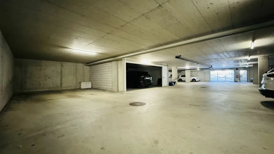 4.5-room maisonette with balcony, 2 wet cells, 2 underground parking spaces, laundry tower, and basement