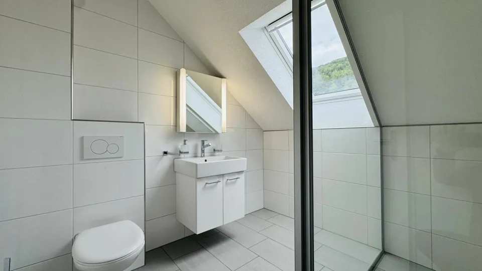 4.5-room maisonette with balcony, 2 wet cells, 2 underground parking spaces, laundry tower, and basement