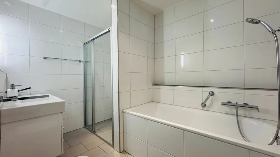 4.5-room maisonette with balcony, 2 wet cells, 2 underground parking spaces, laundry tower, and basement