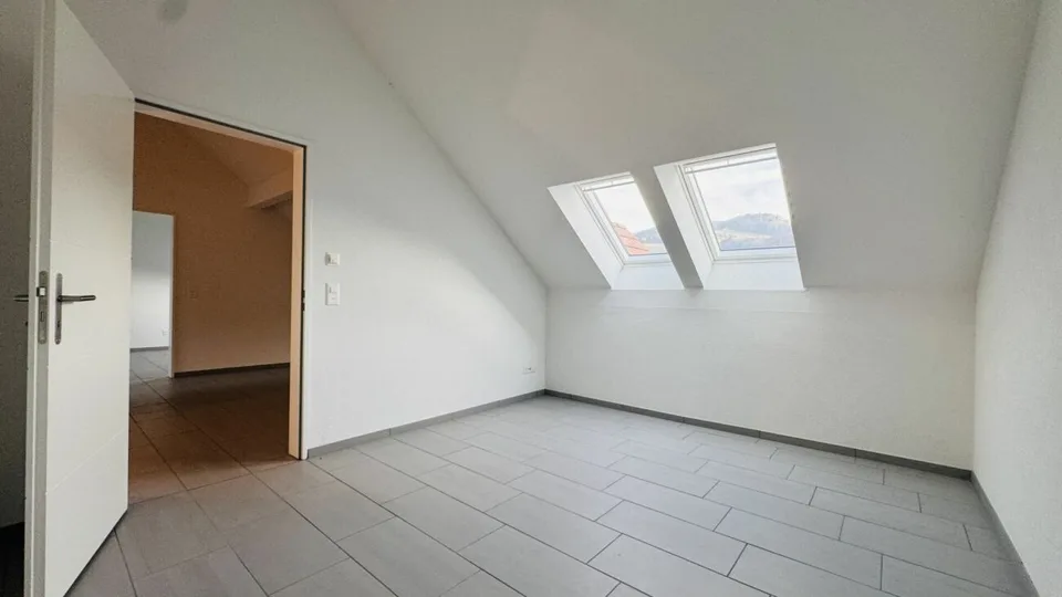 4.5-room maisonette with balcony, 2 wet cells, 2 underground parking spaces, laundry tower, and basement