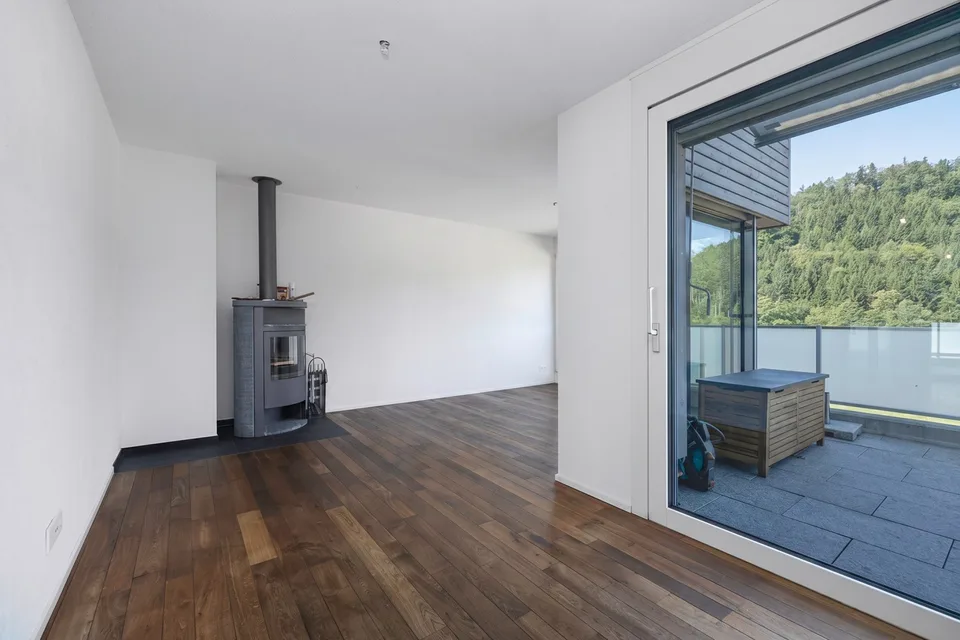 Modern attic apartment with a view of the green