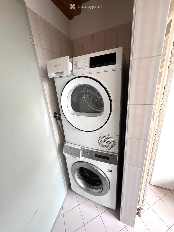 Attractive 3.5-room maisonette apartment in a central location in Beringen with a large garden seating area