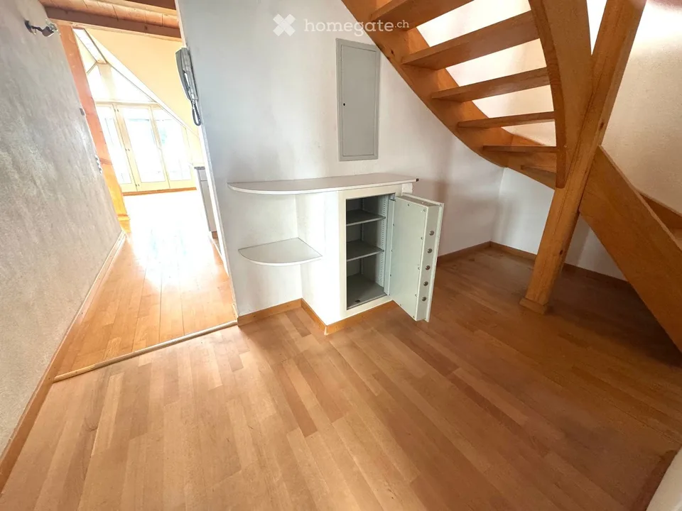 Attractive 3.5-room maisonette apartment in a central location in Beringen with a large garden seating area