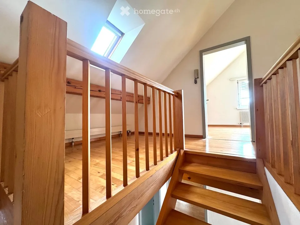 Attractive 3.5-room maisonette apartment in a central location in Beringen with a large garden seating area