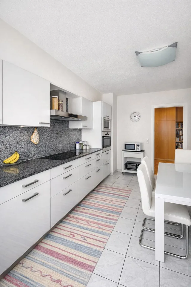 Refined 3.5-room apartment with covered terrace and premium finishes.