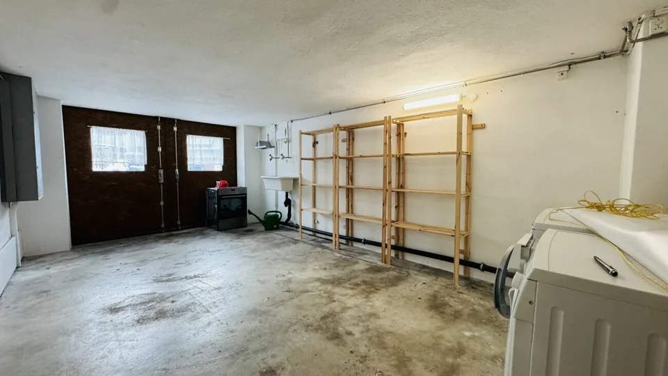 Low-maintenance two-family house with 2 residential units, garage, and 4-5 parking spaces in Ramlinsburg