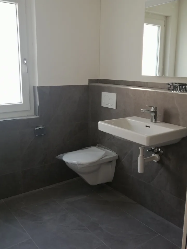 Appartement de 2,5 pièces idéalement situé au 1er étage avec balcon