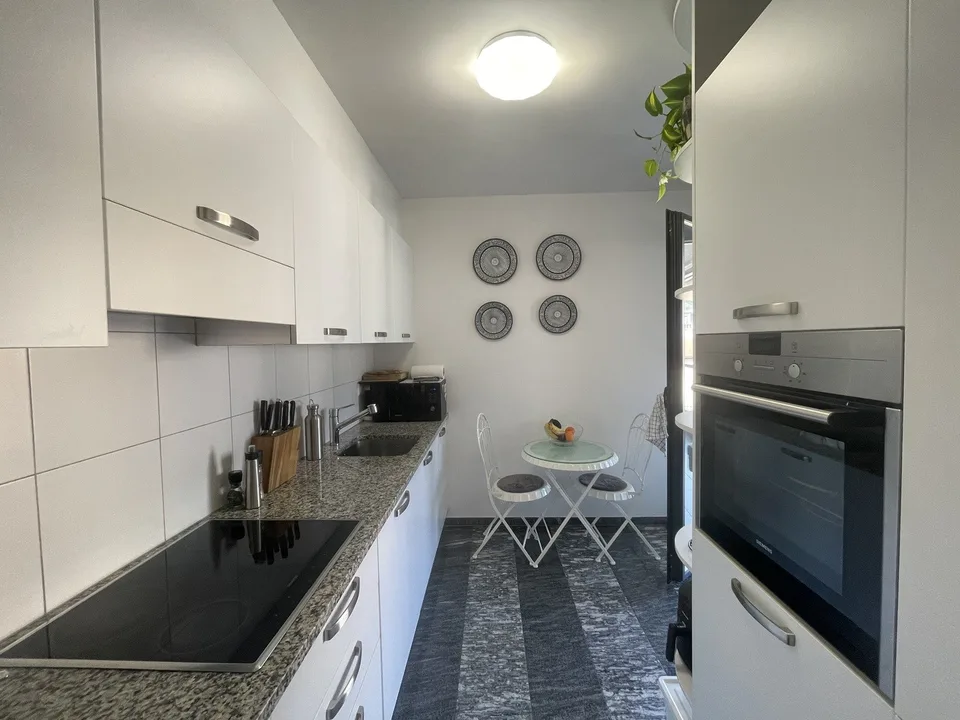 Elegant 4.5-room apartment on the top floor with two parking spaces