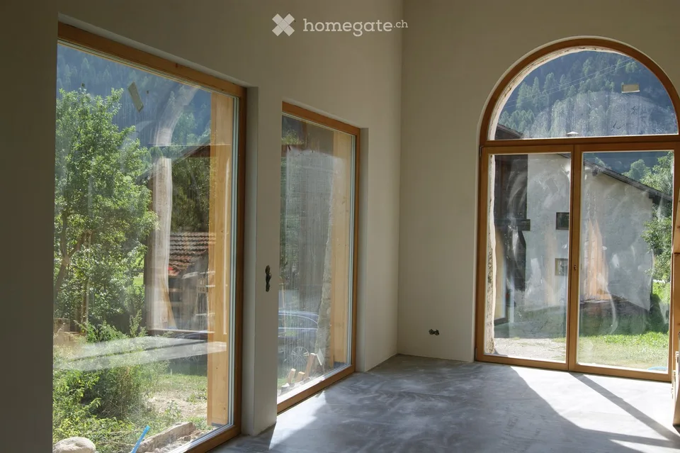 In Müstair in a historic residential building in a quiet, sunny location with a view of the mountains