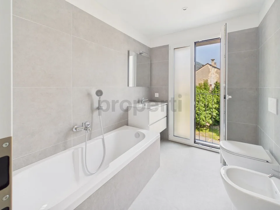 Modern 3.5-room apartment with indoor parking, Biasca