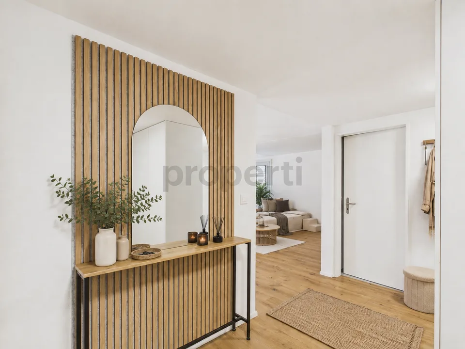 Renovated 3.5-room apartment with private garden seating and modern amenities