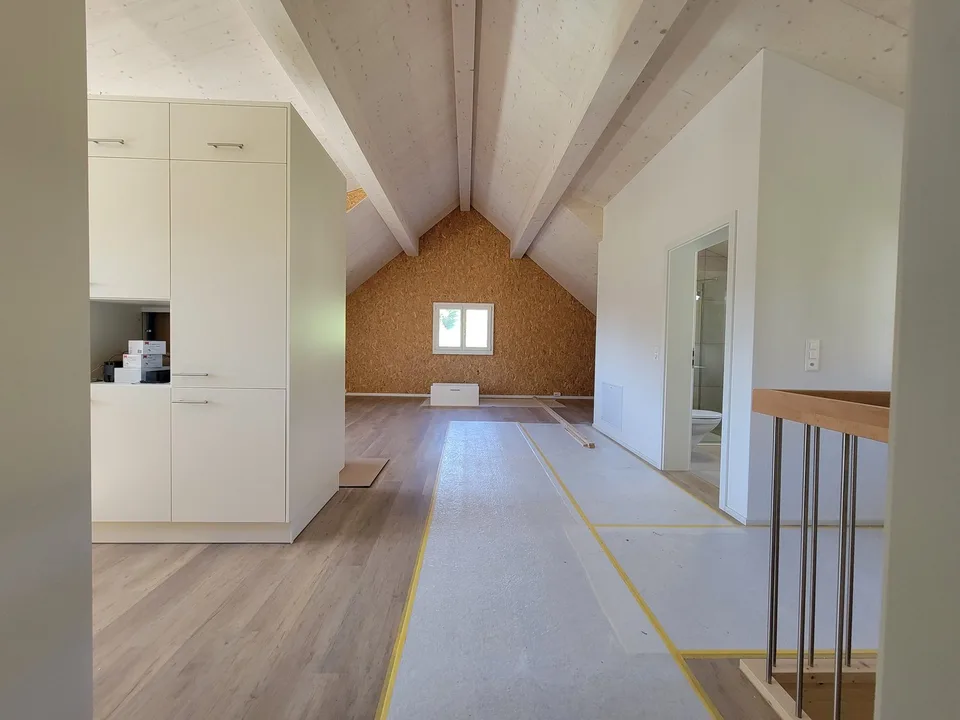 High ceilings in the living room, modern attic renovated in 2024 and stylish expansion