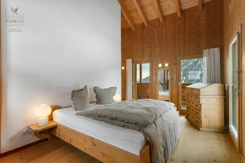 Stylish wooden house with alpine charm and sustainable living and energy concept