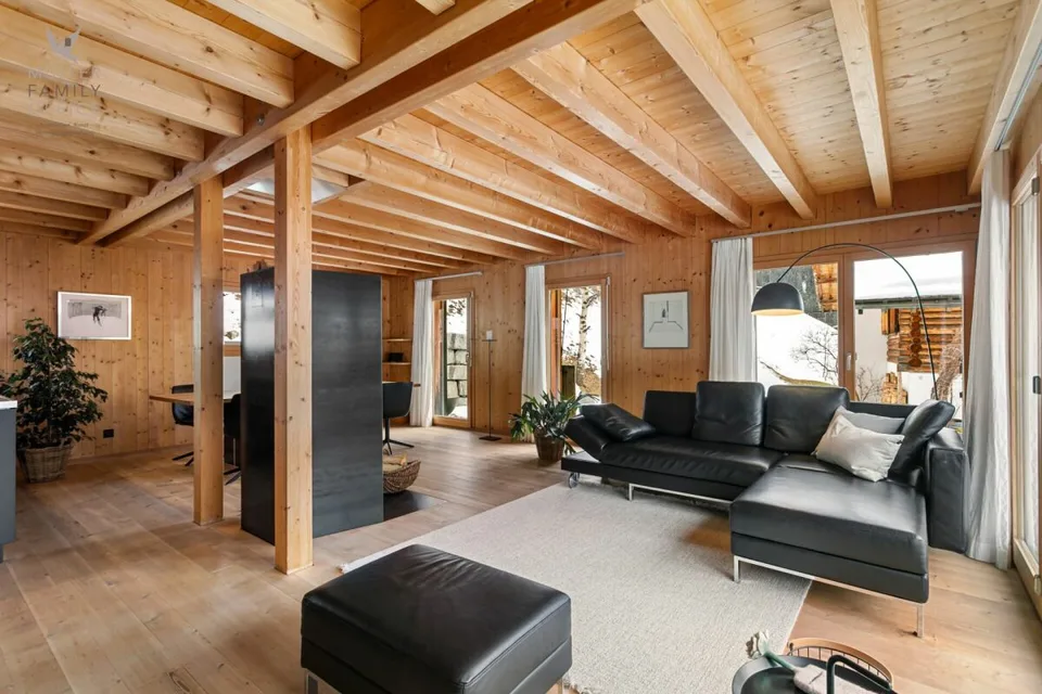 Stylish wooden house with alpine charm and sustainable living and energy concept