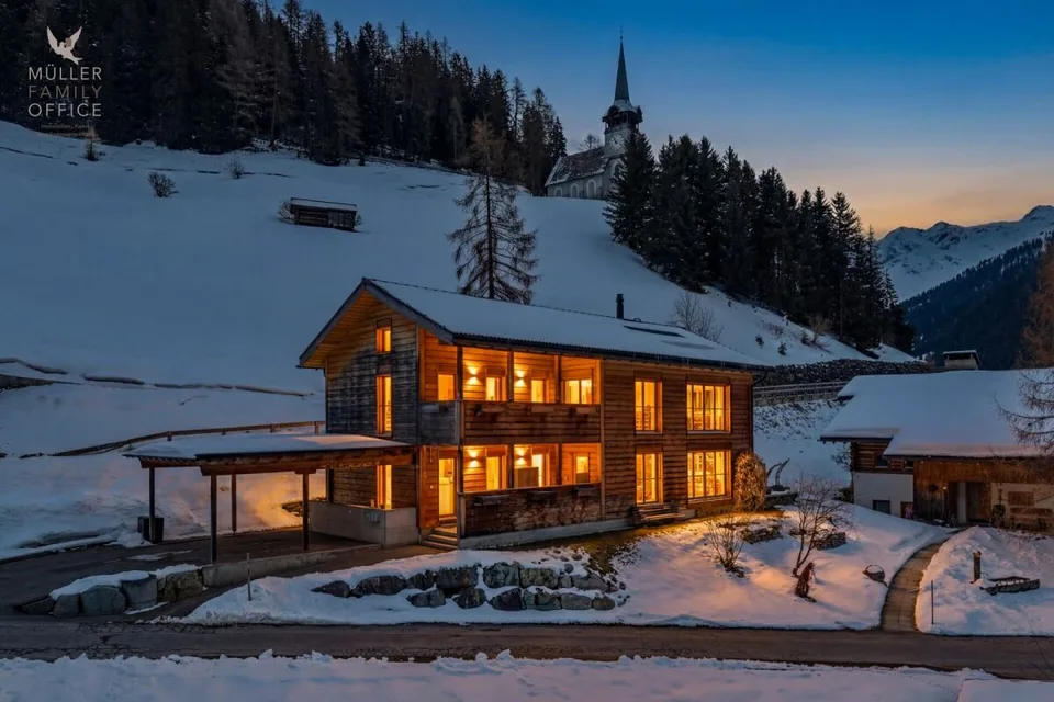Stylish wooden house with alpine charm and sustainable living and energy concept