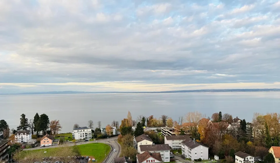 Move in and enjoy - Living where others vacation with unique lake view and balcony