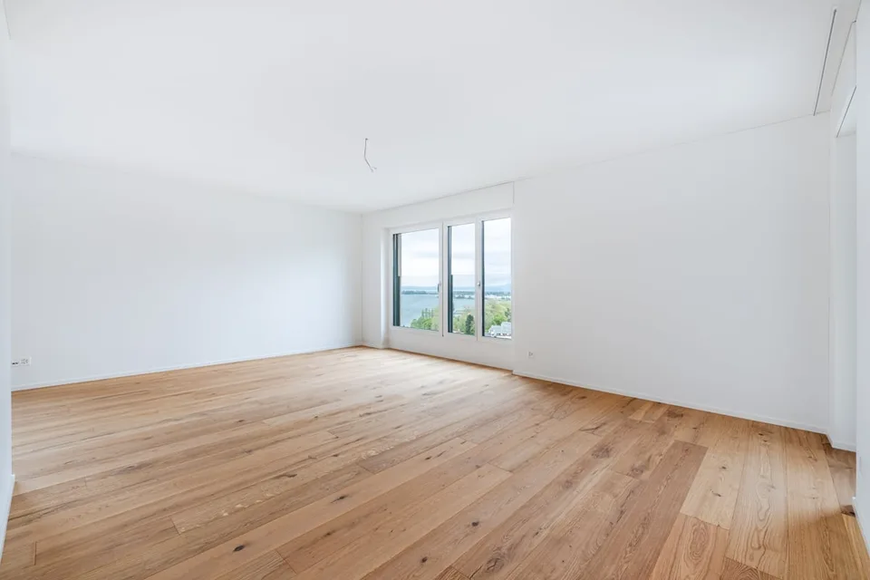 Move in and enjoy - Living where others vacation with unique lake view and balcony