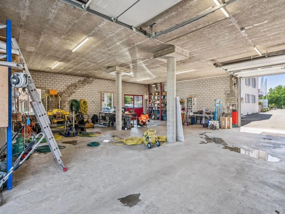 Maison à appartements avec locaux commerciaux, garages - Investissement locatif polyvalent avec potentiel de développement. Copie – photo 25 sur 30