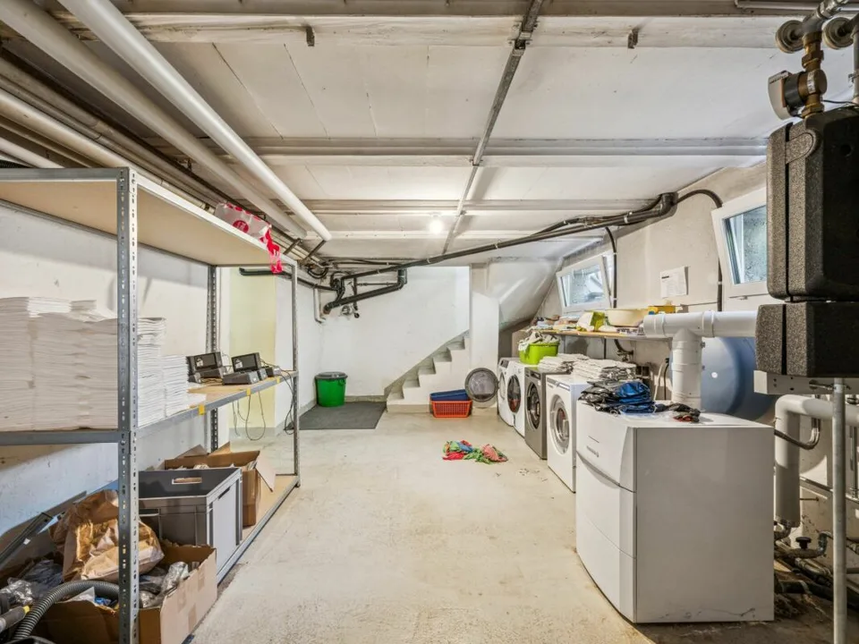 Maison à appartements avec locaux commerciaux, garages - Investissement locatif polyvalent avec potentiel de développement. Copie – photo 28 sur 30