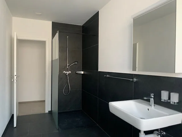 Newly built 3.5-room apartment directly at the train station