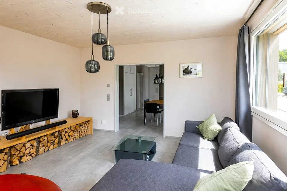 Appartement 2.5 pièces avec une atmosphère de maison et terrasse privée