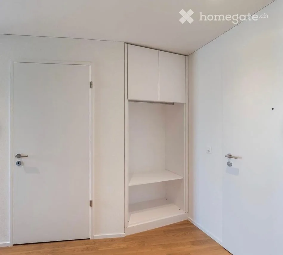 Appartamento attico moderno di 2,5 locali in un edificio nuovo