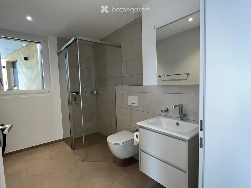 Appartamento moderno semidetachato di 2,5 locali con balcone coperto e piccolo spazio giardino