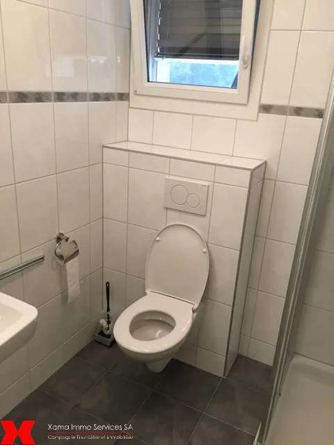 Spacieux appartement de 5.5 pièces avec balcon au 1er étage