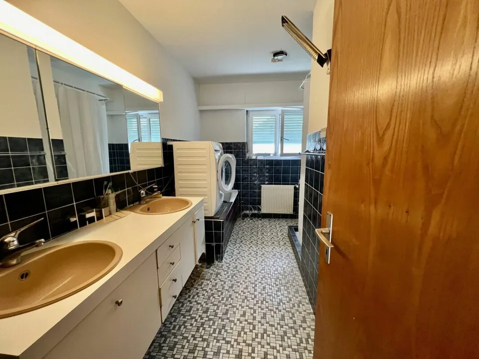 Maison multifamiliale entièrement louée avec trois grands appartements – photo 9 sur 13