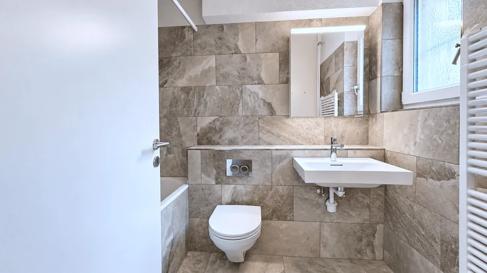 Appartement de 3,5 pièces rénové au 1er étage – photo 3 sur 4