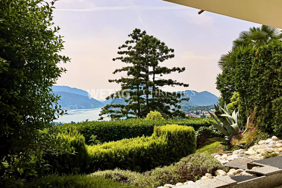 Elegante appartamento triplex a Porza con vista lago, giardino privato, piscina e sauna comuni in vendita – foto 13 di 13
