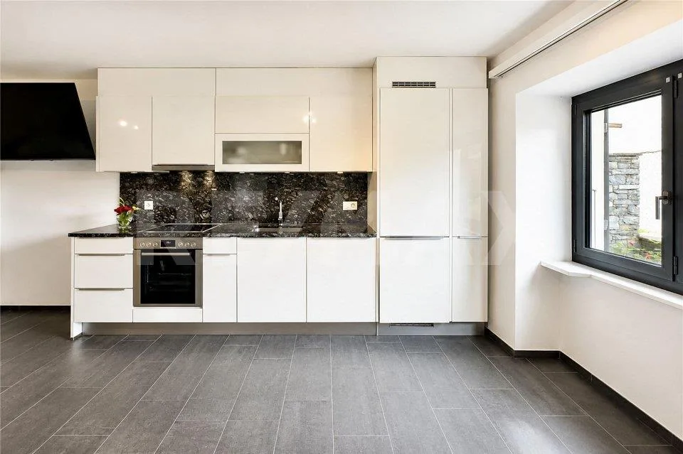 Casa con giardino e 4 posteggi – Foto 8 von 12