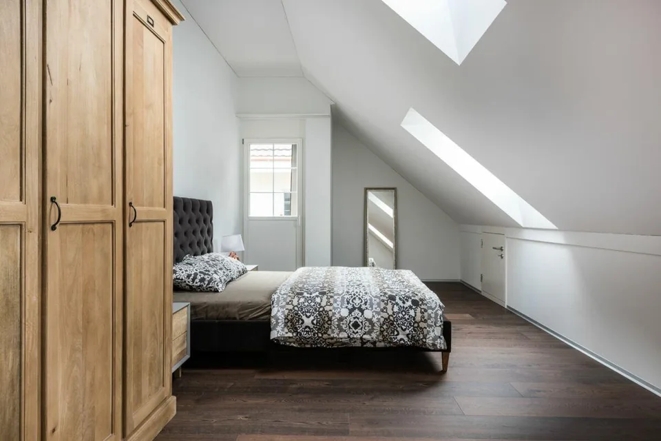 Modern attic apartment with new building character